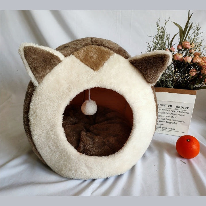 Cozy closed cat litter box in a soft, round design with cat ears for comfort and privacy