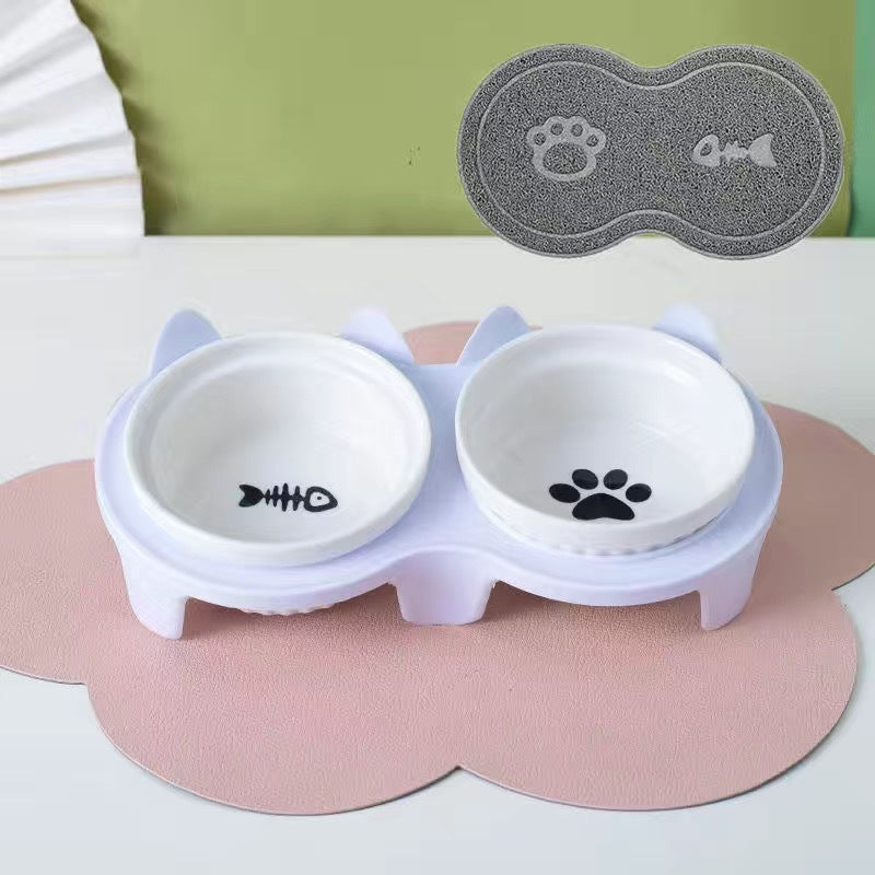 Ceramic cat bowl set featuring a cute design with fish and paw prints for pet feeding