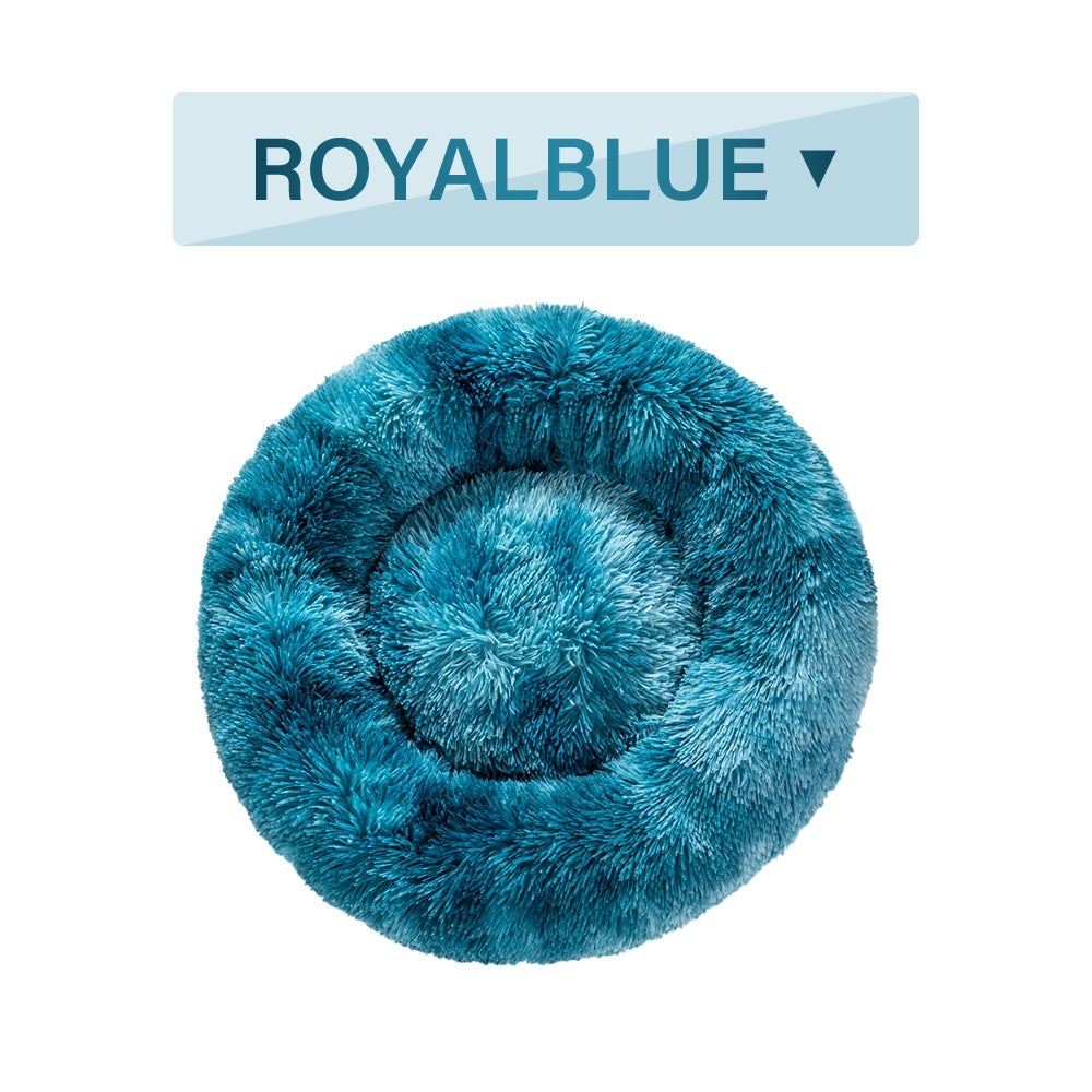 Royal blue fluffy donut dog bed made from soft, plush material for ultimate pet comfort
