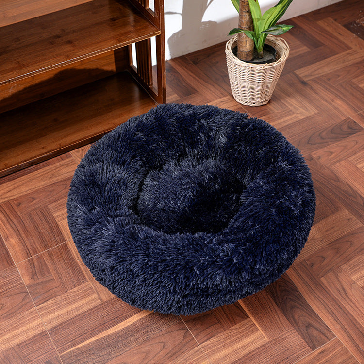 Side view of pet bed with raised edges for neck and head support