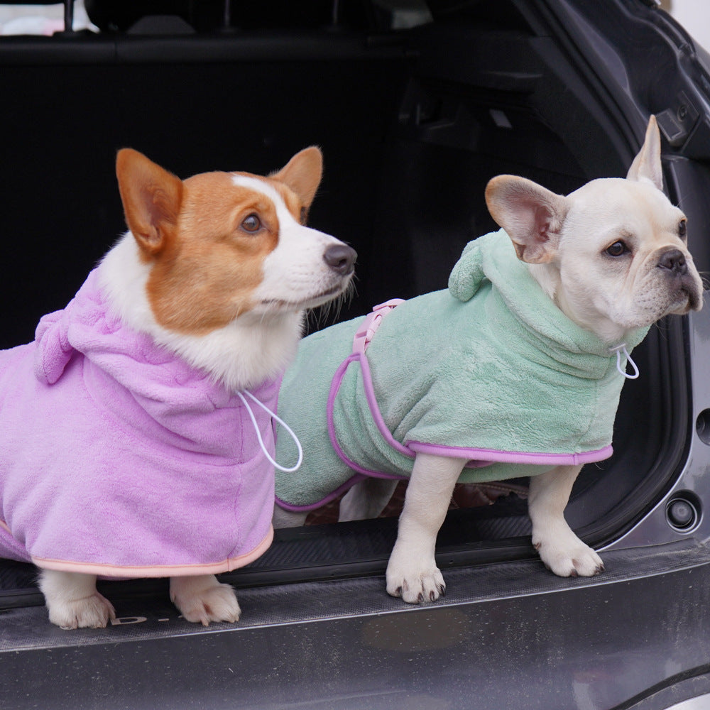 Two dogs wearing colorful hooded towels for drying, featuring a super absorbent dog towel design