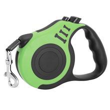 Green telescopic dog leash with ergonomic handle for comfortable walks and easy control