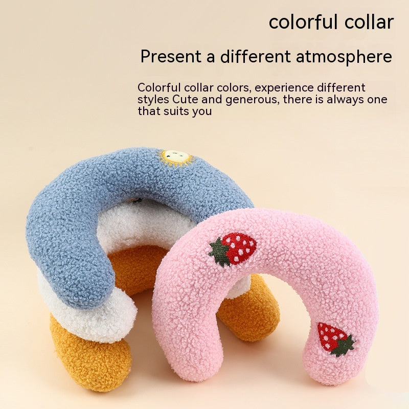 Two cozy half-donut-shaped cat pillows in pink and yellow, designed for neck protection and deep sleep comfort