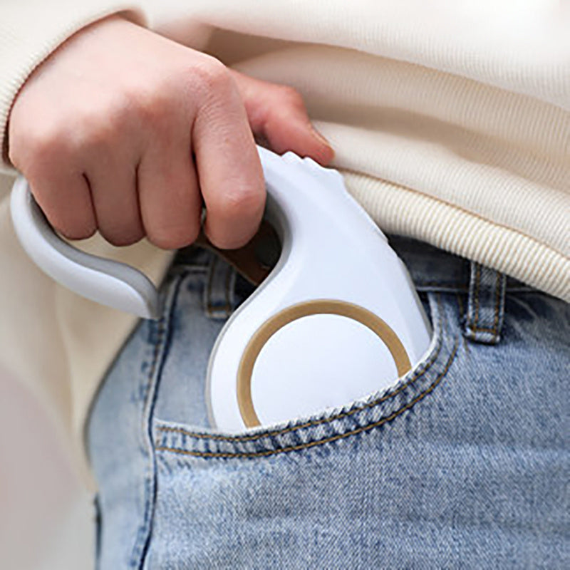 Hand holding a white automatic pet traction rope, designed for easy pet walking and control