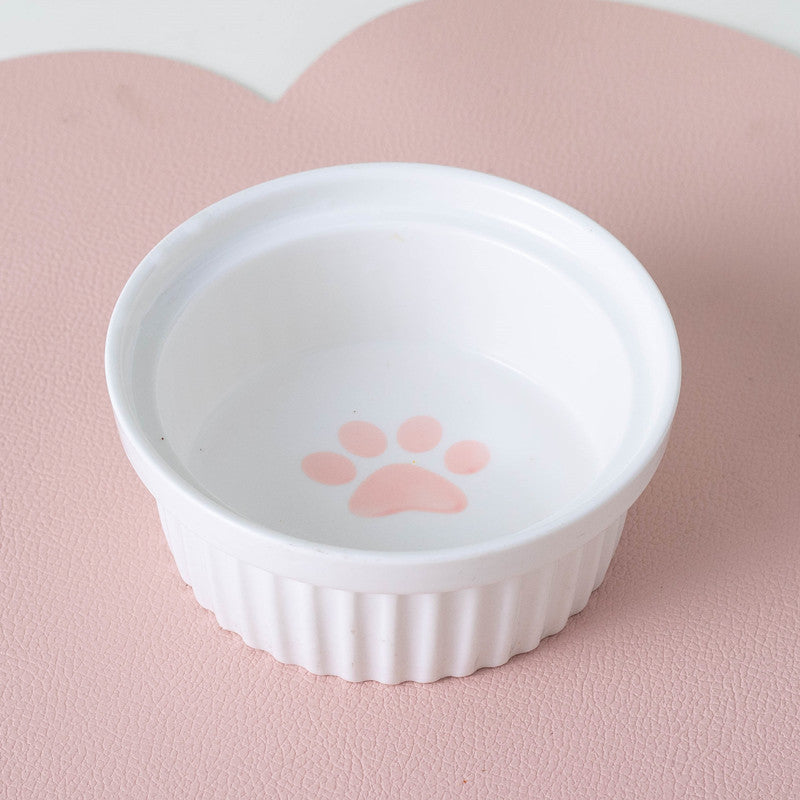 Ceramic cat bowl set with a cute pink paw print design for serving food and water