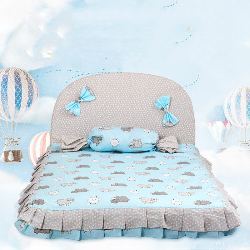 Creative dog mat in soft blue with cloud patterns and decorative bows for a comfortable pet sleeping space