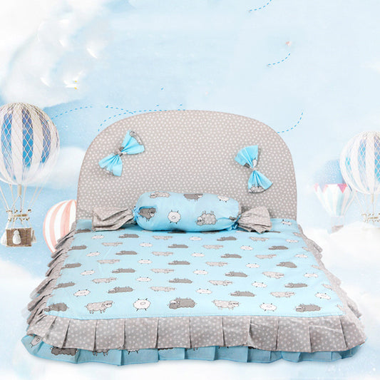 Creative dog mat in soft blue with cloud patterns and decorative bows for a comfortable pet sleeping space