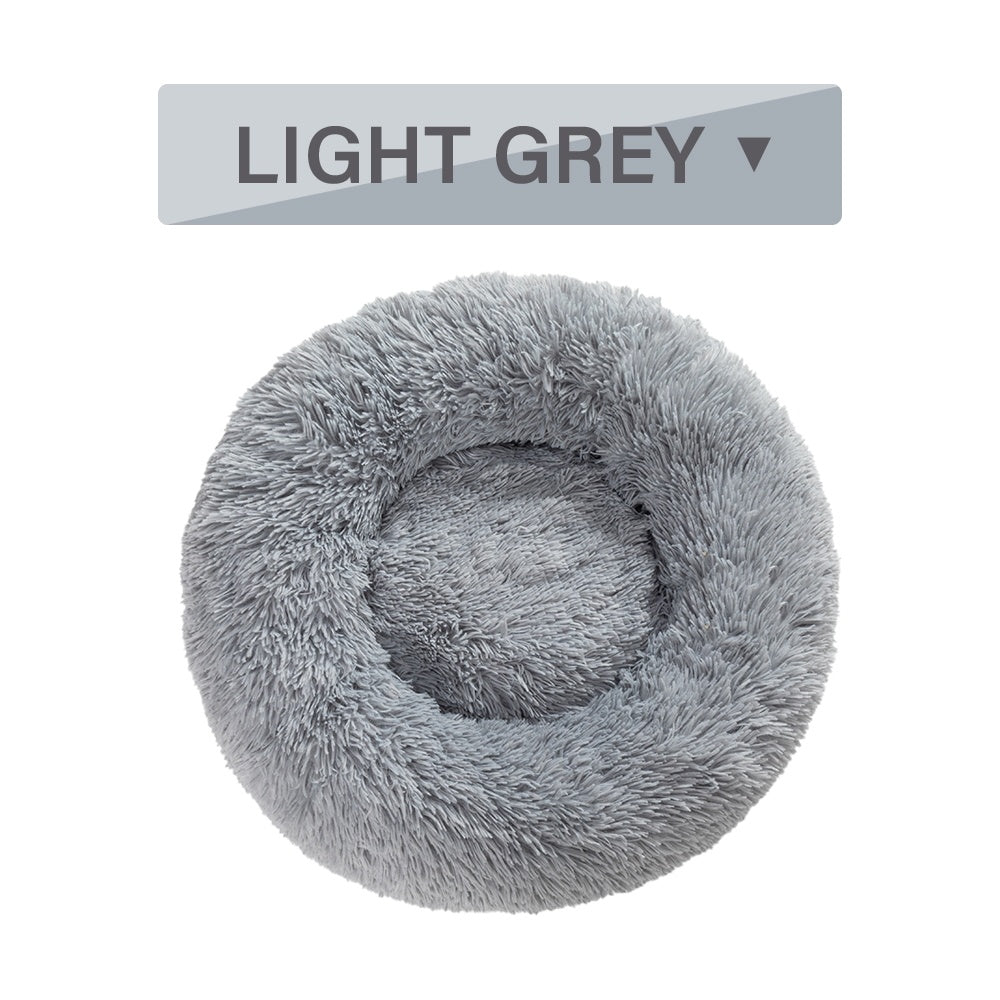 Fluffy donut dog bed in light grey, perfect for cozy naps and comfort for pets