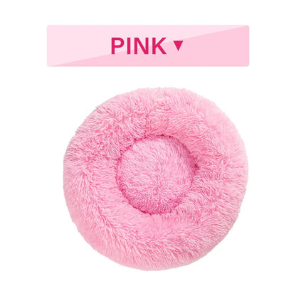 Fluffy donut dog bed in soft pink, perfect for keeping pets cozy and comfortable