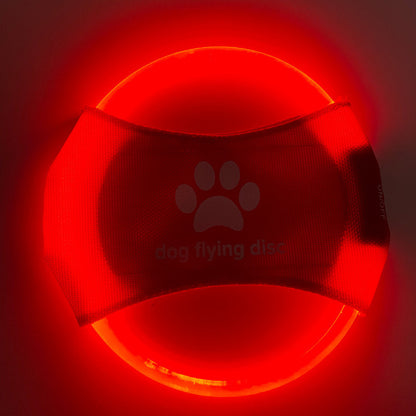 LED dog flying disc in bright red light, perfect for nighttime play with pets