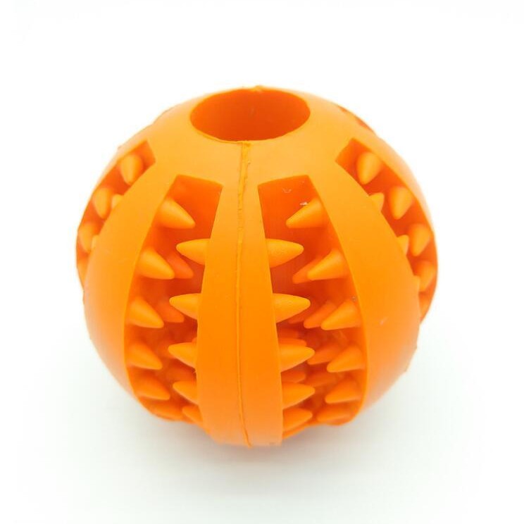 Bright orange rubber dog ball toy with spiky texture for enhanced grip and playtime fun
