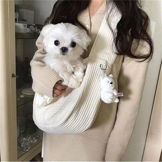 Soft cushion dog travel bag designed for pet comfort, shown with a small dog being carried