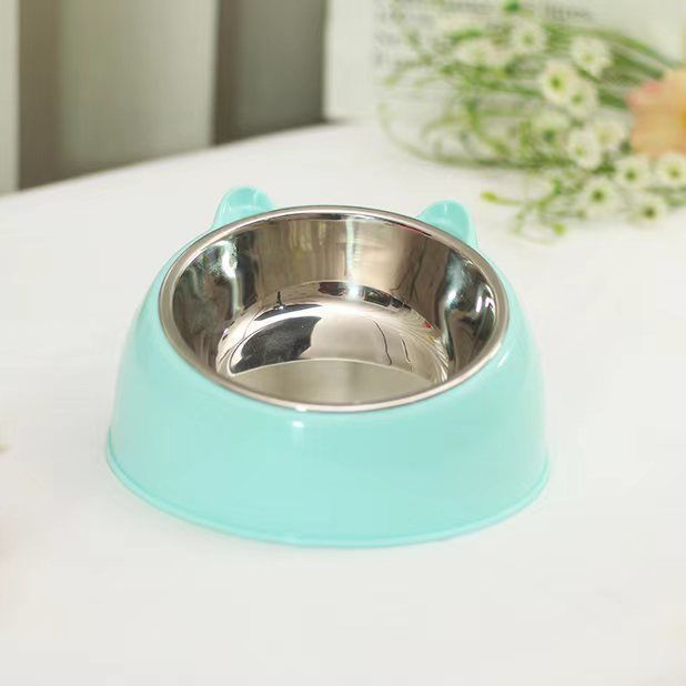Stainless steel dog bowl with a cute blue base designed for pets